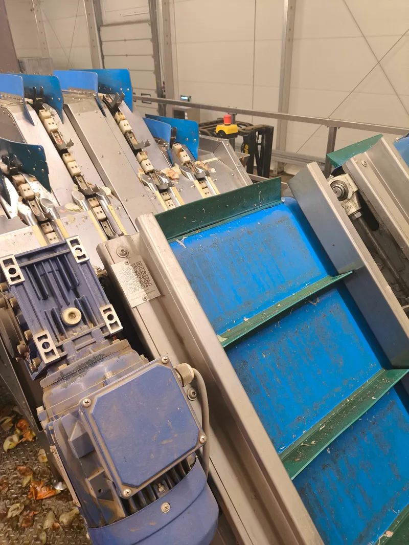 Production line machinery detail with a QR-coded maintenance point representing the maintenance operations case study.
