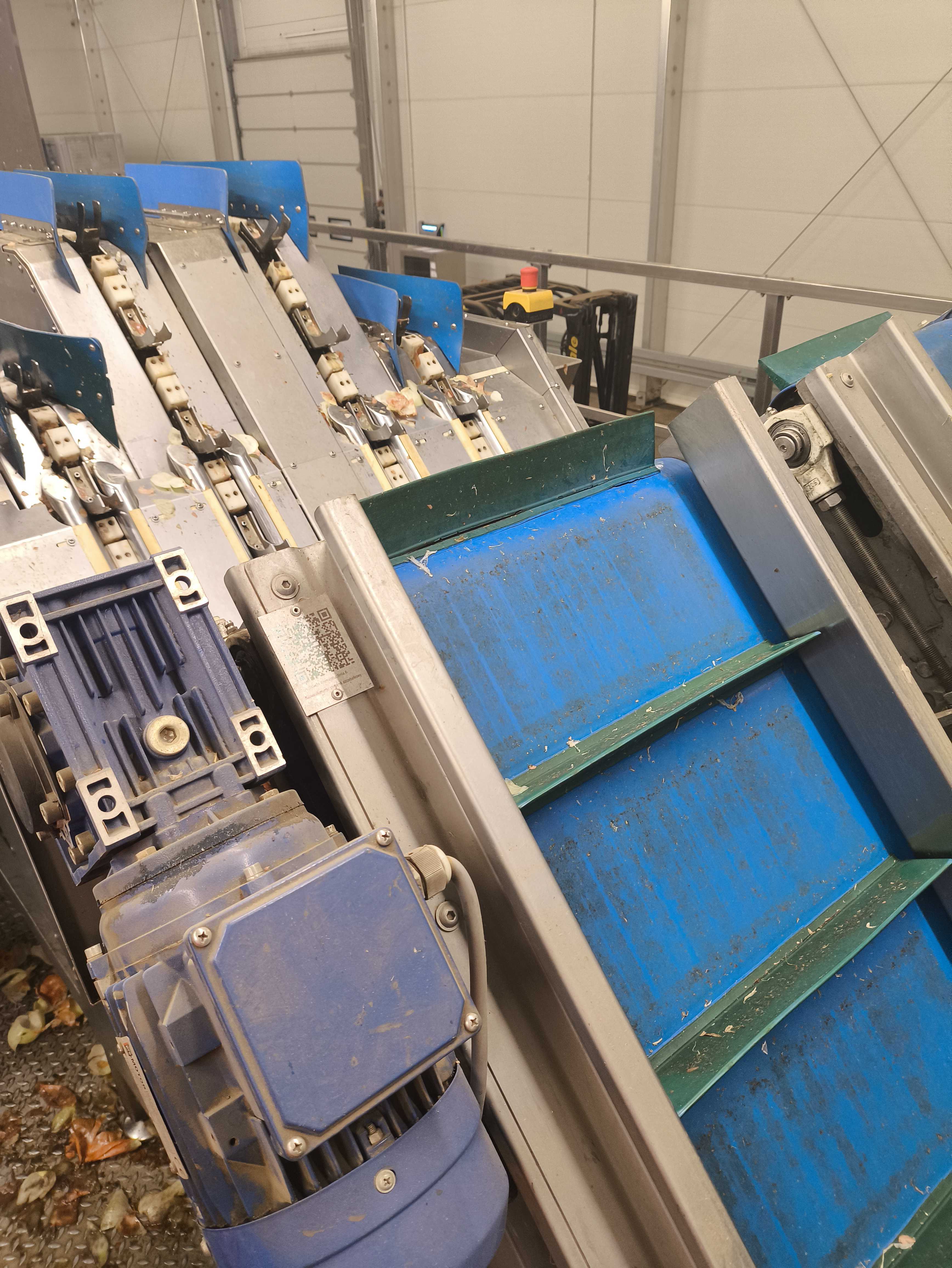 Production line machinery detail with a QR-coded maintenance point representing the maintenance operations case study.