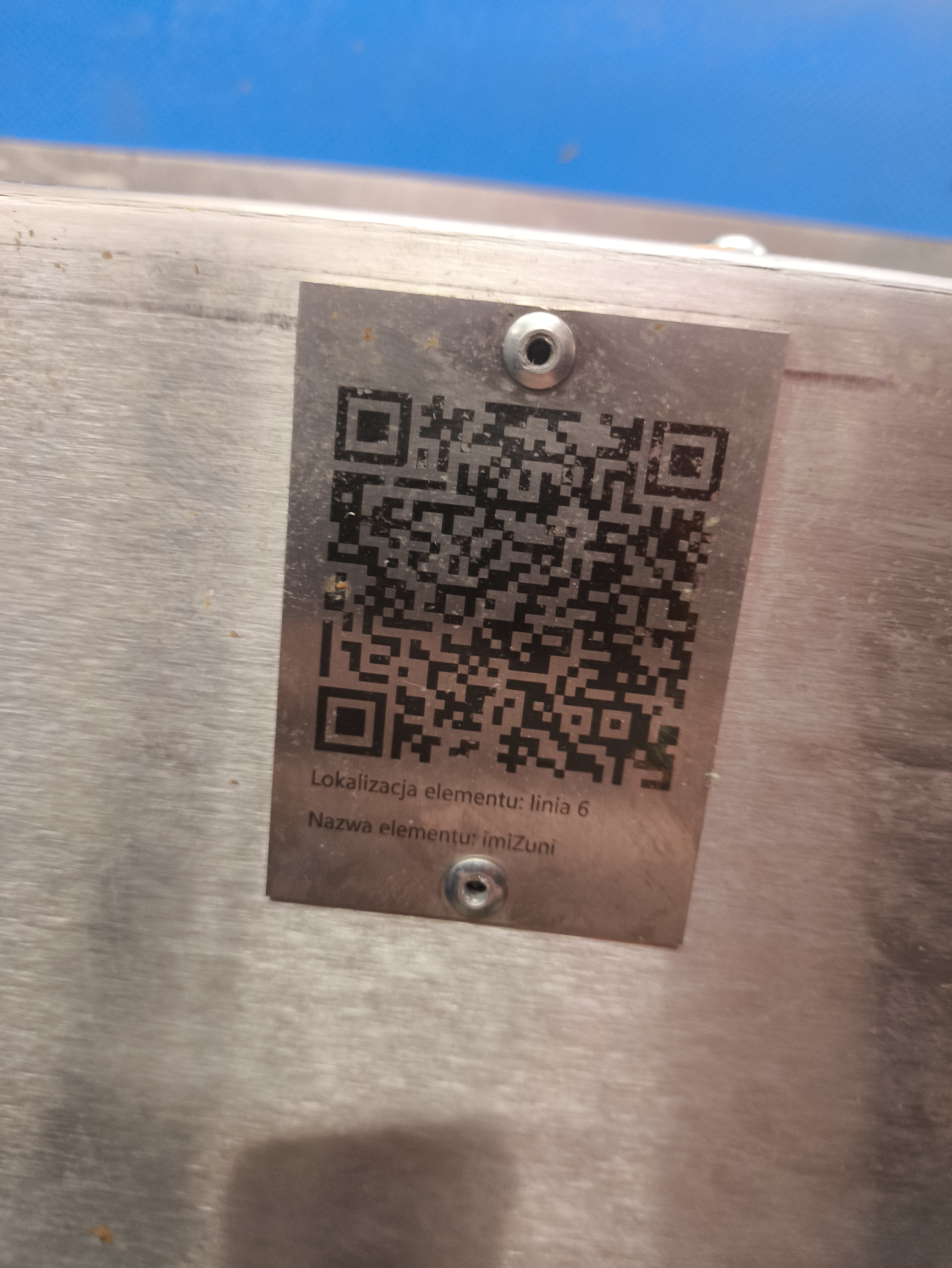 QR label attached to industrial equipment for faster maintenance access.
